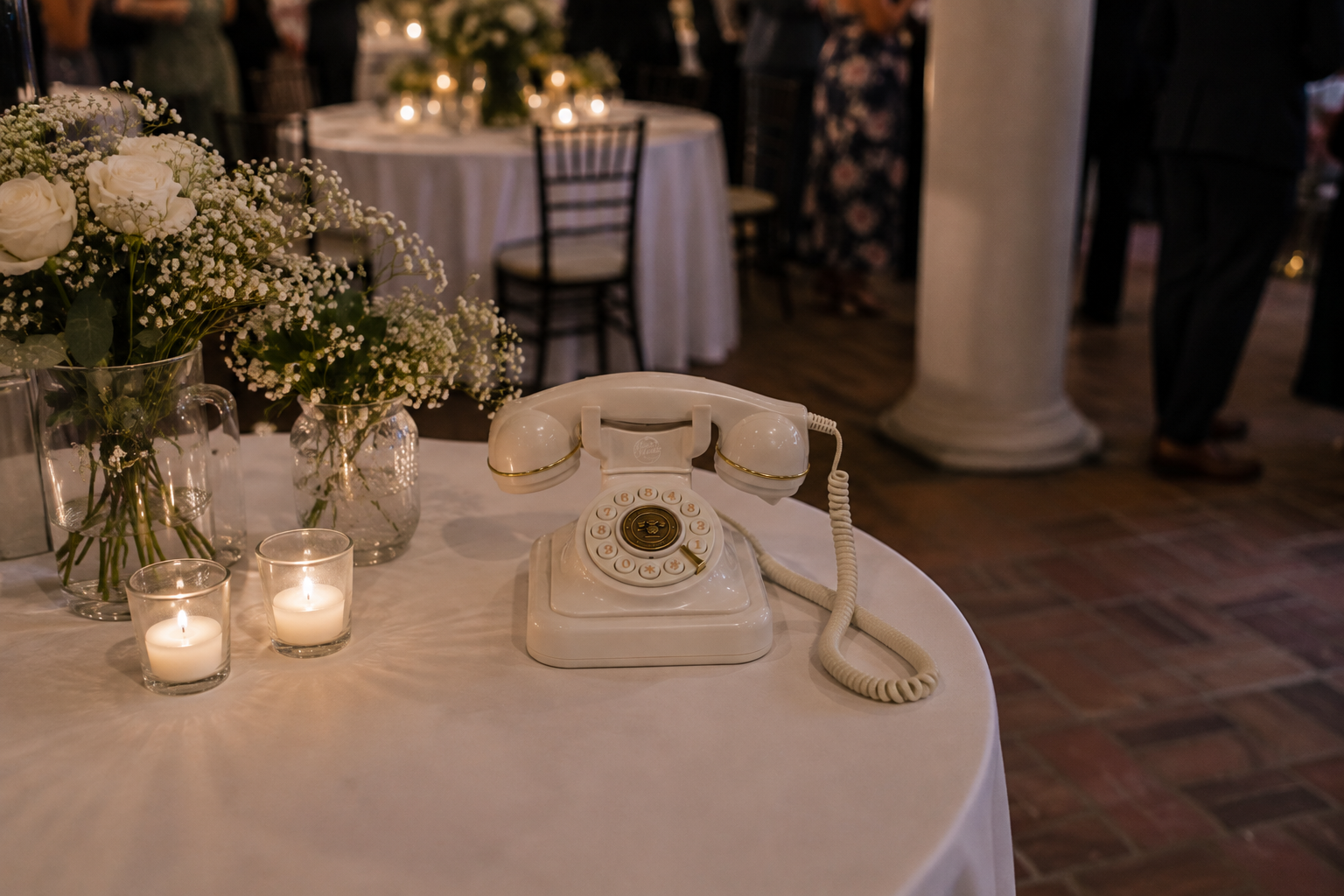 White vintage VoiceMento wedding audio guestbook displayed at a wedding reception